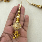 Rhinestone Floral Ball Latkan held in hand showing size and detail