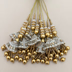 Group of gold and silver-tone jhumka latkan tassels with white bead detailing; sold as a pack of two