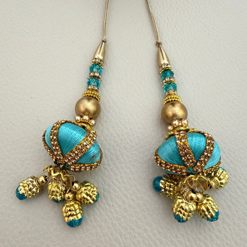 Pair of turquoise and gold-tone beaded latkan tassels with dangling charms, SKU TSL1224
