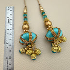 Group view of turquoise and gold-tone latkan tassels; sold as a pack of 2