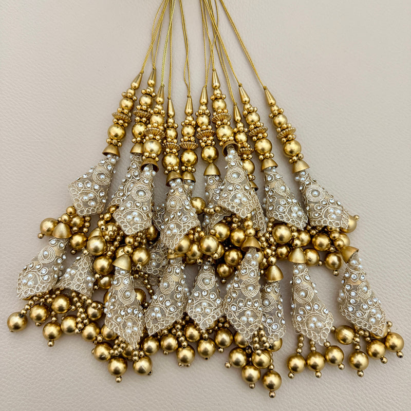 Pair of gold-tone double-tier cone latkan tassels with white pearl-style accents and dangling beads, TSL1225