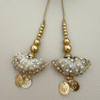 Pair of ivory and gold umbrella latkan tassels with pearl-look beads and dangling coin charms